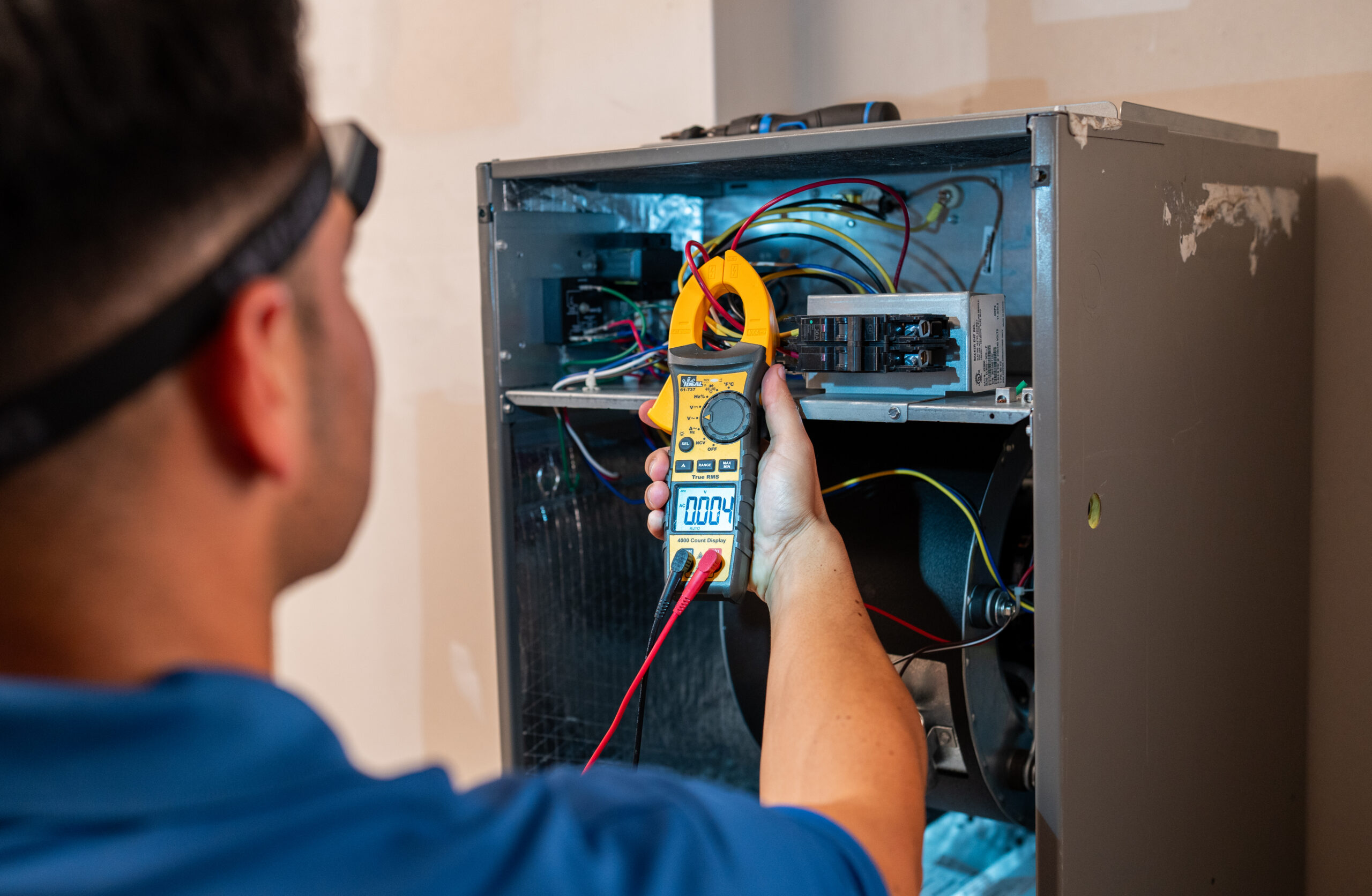GAC Services Technician Checking heating